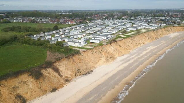 Pan shot of Pakefield Beach with cityscape at background in Suffolk, England. Drone view.