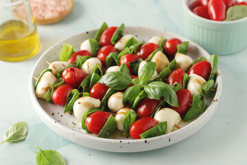 A plate with Italian salad caprese canape	
