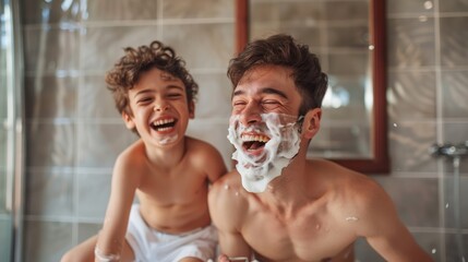 A father and his son laughing while applying facial wetshaving foam in the bathroom, having fun together during their morning routine.