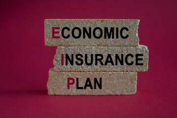 EIP economic insurance plan symbol. Concept colorful words EIP economic insurance plan on brick blocks. Beautiful red background. Business EIP economic insurance plan concept.