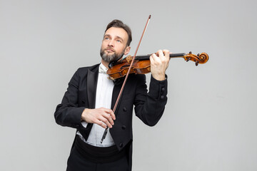 Man classic violinist at musical elegant performance