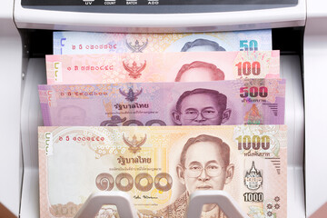 Thai baht in a counting machine
