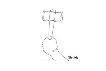 Hand holding toy hammer. Sao joao concept one-line drawing