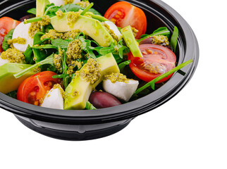 Fresh avocado salad in a black bowl