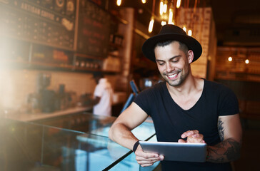 Tablet, man and coffee shop portrait with writer and freelancer working on article or blog. Smile,...
