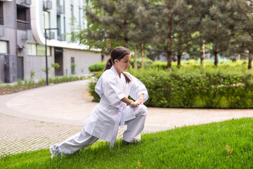 young girl in a white kimono, karate