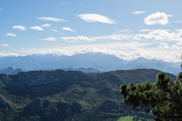Naklejka premium The Picos de Europa with some cloud on a sunny day.