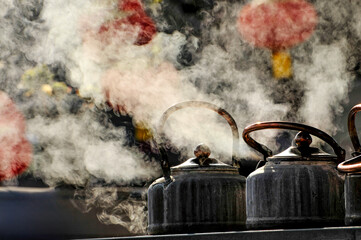Tea kettles on the coal stove in an old Chinese tea house 
