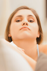 Aloof young woman, sarcastic smile, subtly superior