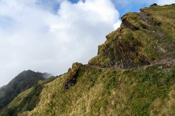 Scenic view of a mountain range blanketed in fog.