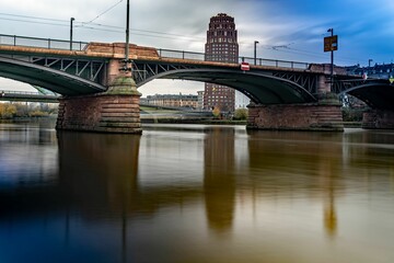 Fototapeta premium Scenic view of Ignatz Bubis bridge spanning the river. Frankfurt, Germany