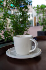 Close-up cup of espresso on the wooden table.
