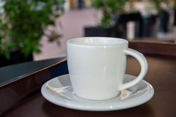 Close-up cup of espresso on the wooden table.