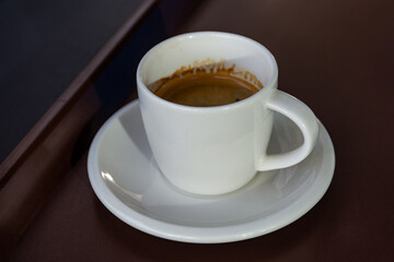 Close-up cup of espresso on the wooden table.