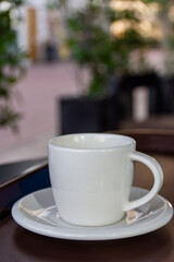 Close-up cup of espresso on the wooden table.