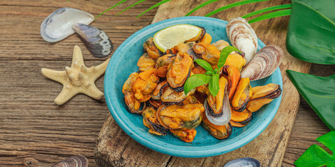 Mussels with oil, spices and greens. Healthy seafood is rich in omega. Marine decor