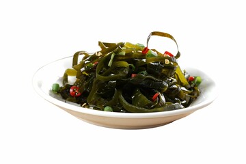 White plate with fresh seaweed arranged in the shape of a spoon.