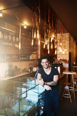 Happy, coffee shop and portrait of man by counter ready for serving caffeine, drinks and beverage for small business. Restaurant, hospitality and confident waiter for service, help or welcome in cafe