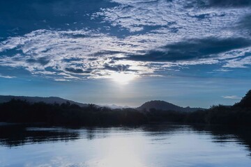 Picturesque sunset over a tranquil river in  Guajimico, Cienfuegos, Cuba.