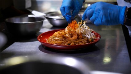 Caucasian adult person serving a Thai meal for lunch