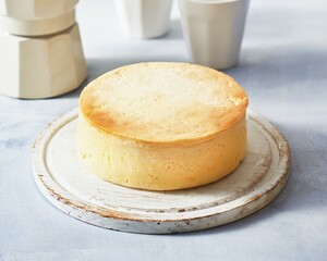 Classic mini cheesecake recipe. Cheesecakes close-up on a light grey background.