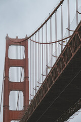 World famous red steel suspension bridge in San Francisco port entrance with Golden Gate State park nature landscape coastal California panoramic beauty scenery