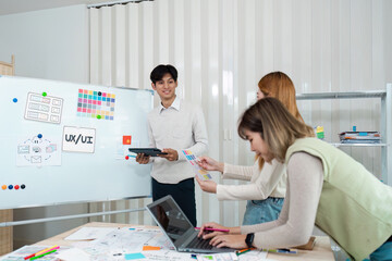 team of UI UX web designer are working together to develop mobile responsive websites with UI UX...