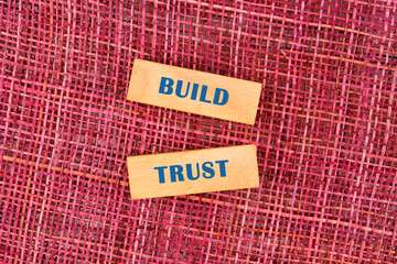 Build trust symbol made up of wooden blocks