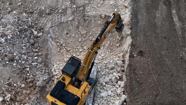 Highway Construction: Drone View of Caterpillar Breaking Rock