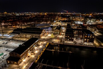 Fototapeta premium Aerial view of Port Noblessner in Tallinn, Estonia at night with a festive Christmas tree