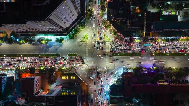 Aerial timelapse of evening traffic at an intersection in Hanoi, Vietnam.