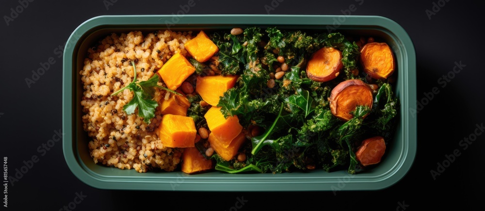Poster an overhead view of a lunch box bowl containing sauteed kale quinoa and roasted sweet potato with sp