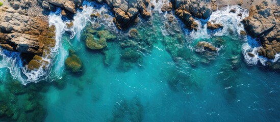 Aerial view of the coastline The azure turquoise sea borders on a stone coast Copy space