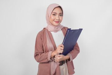 Stylish Asian woman wearing hijab holding document smiling happily isolated by white background.