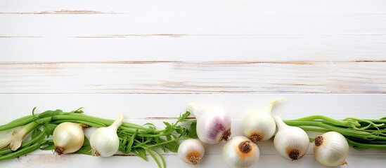 spring and spanish onions on white wood table background. copy space available