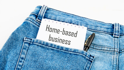 Text Home based business on a notebook from a pocket next to a pen