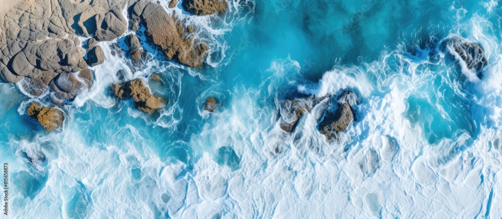 Poster Aerial view of the coastline The azure turquoise sea borders on a stone coast Copy space