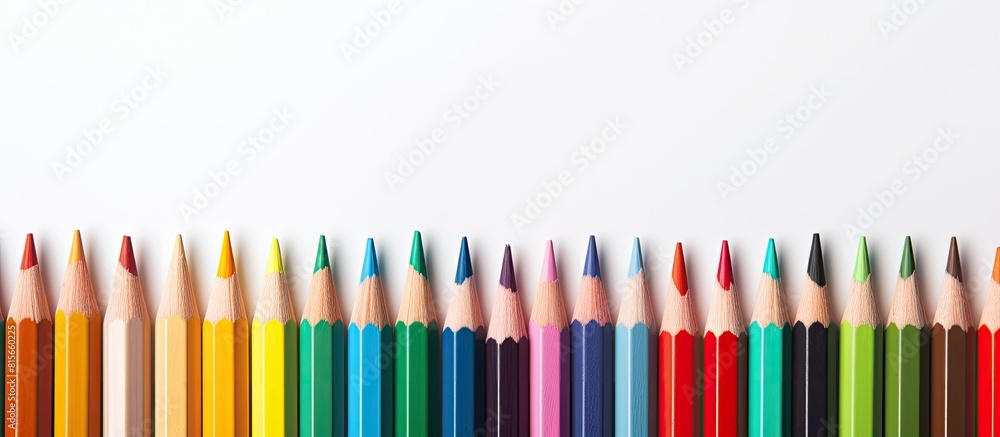 Poster multicolored pensils in the box on the white paper back to school copy space top view