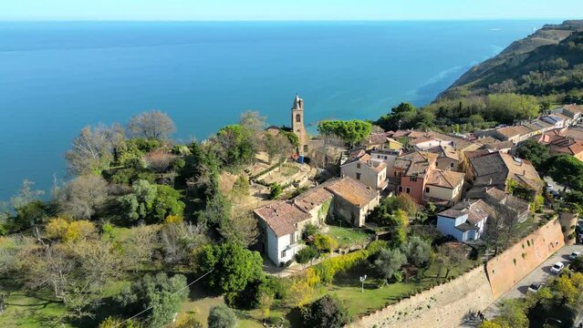Drone footage of Fiorenzuola di Focara medieval village on the Mediterranean coast in Pesaro, Italy