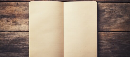 Vintage style pictures of blank notebook paper on a wooden background with a vintage effect providing ample space for copy or images