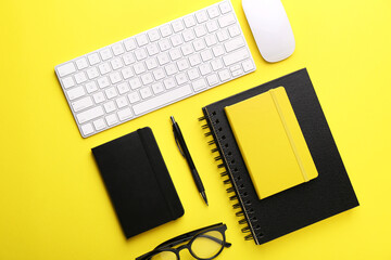 Flat lay composition with office stationery on yellow background
