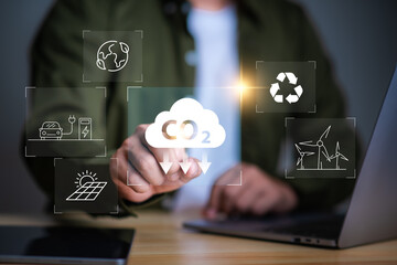 Reduce co2 emission. man using software to lower CO2 emissions to limit global warming and climate change,