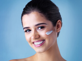 Smile, skincare and girl with face cream in studio mockup for wellness, cosmetics or skin detox on...
