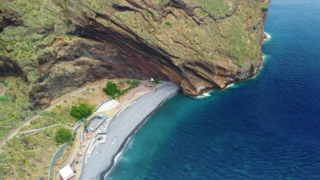 Ascending drone footage of Garajau Beach in the coastal town of Canico, Madeira, Portugal