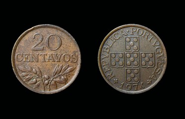 Closeup of Portugese 20 centavos coins on a black background
