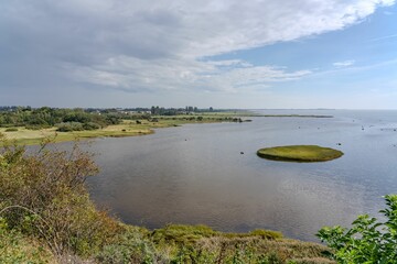 a view of the water with a grassy area on top
