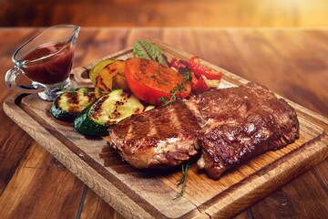 A tasty hot aroma steak meat on a cutting board