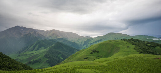 Cloudy and rainy day in spring, low storm clouds.Summer mountain landscape. Amazing view of the...