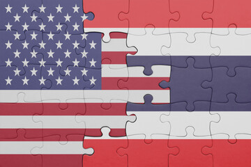 puzzle with the colourful national flag of thailand and flag of united states of america .