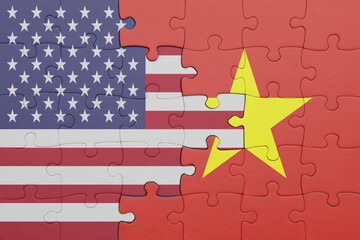 puzzle with the colourful national flag of vietnam and flag of united states of america .
